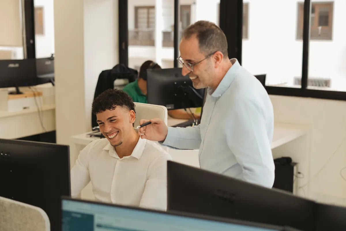 Victor and Jesus working at Strong Law and Compliance
